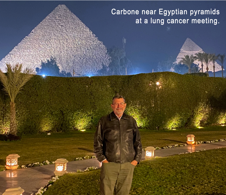 Carbone near Egyptian pyramids at a lung cancer meeting.