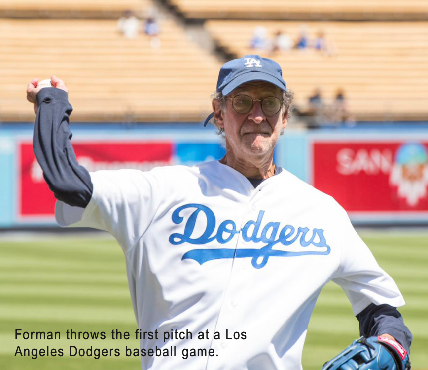 Forman throws the first pitch at a Los Angeles Dodgers baseball game.
