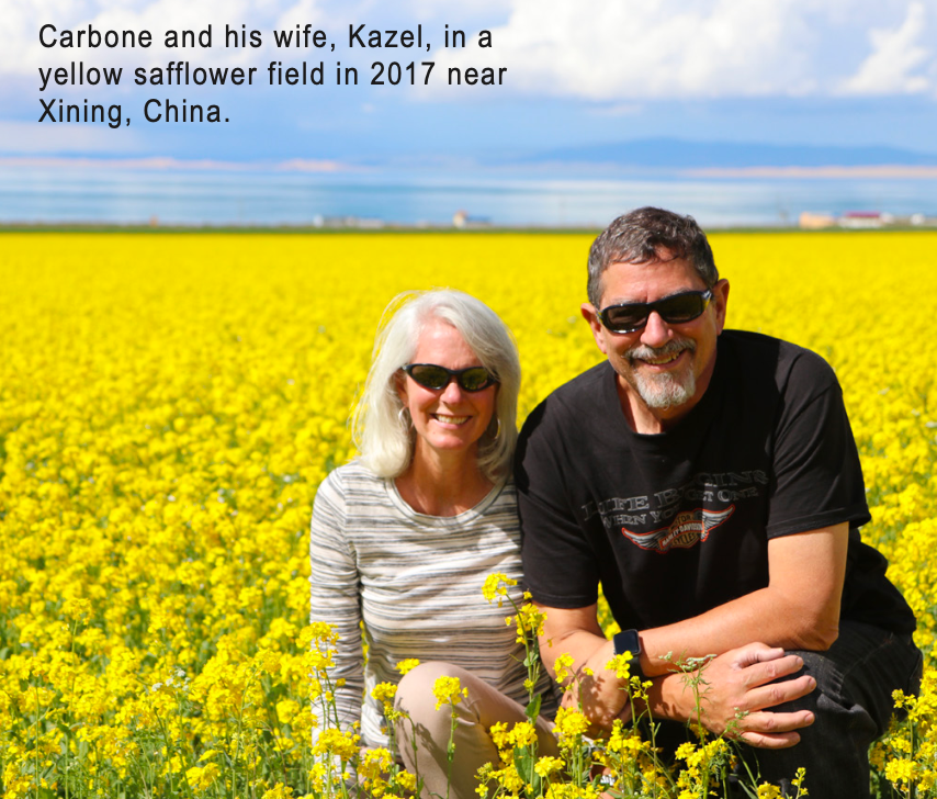 Carbone and his wife, Kazel, in a yellow sunflower field in 2017 near Xining, China.