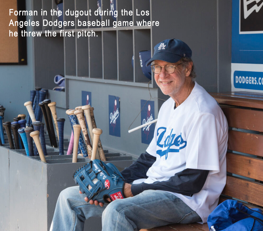 Forman in the dugout during the Los Angeles Dodgers baseball game where he threw the first pitch.