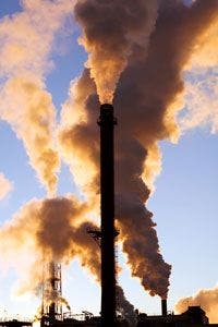 Air pollution coming out of smoke stacks